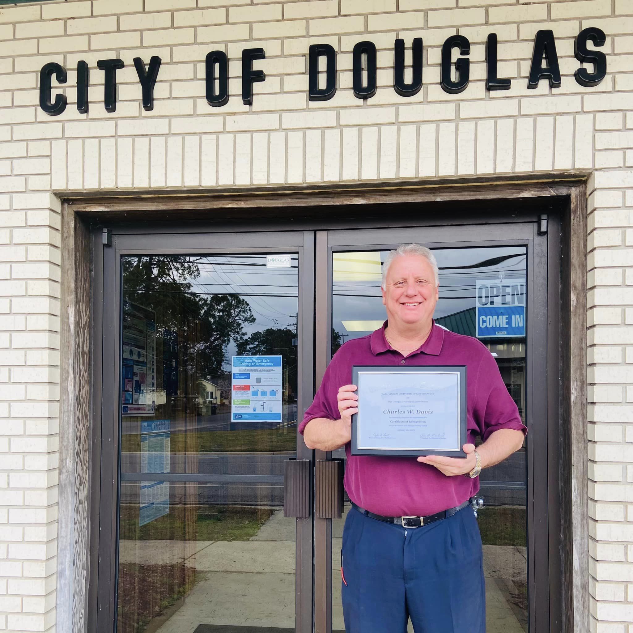 Image of Charlie Davis with the Certificate of Recognition