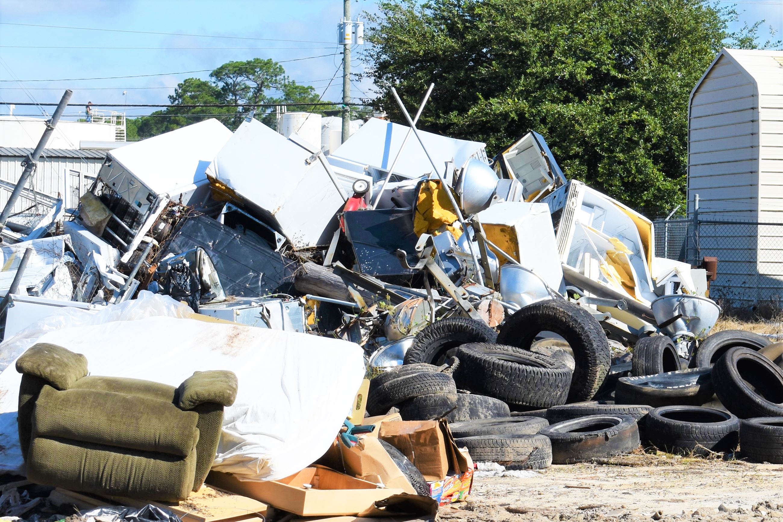 Image of tires, mattresses, junk pile