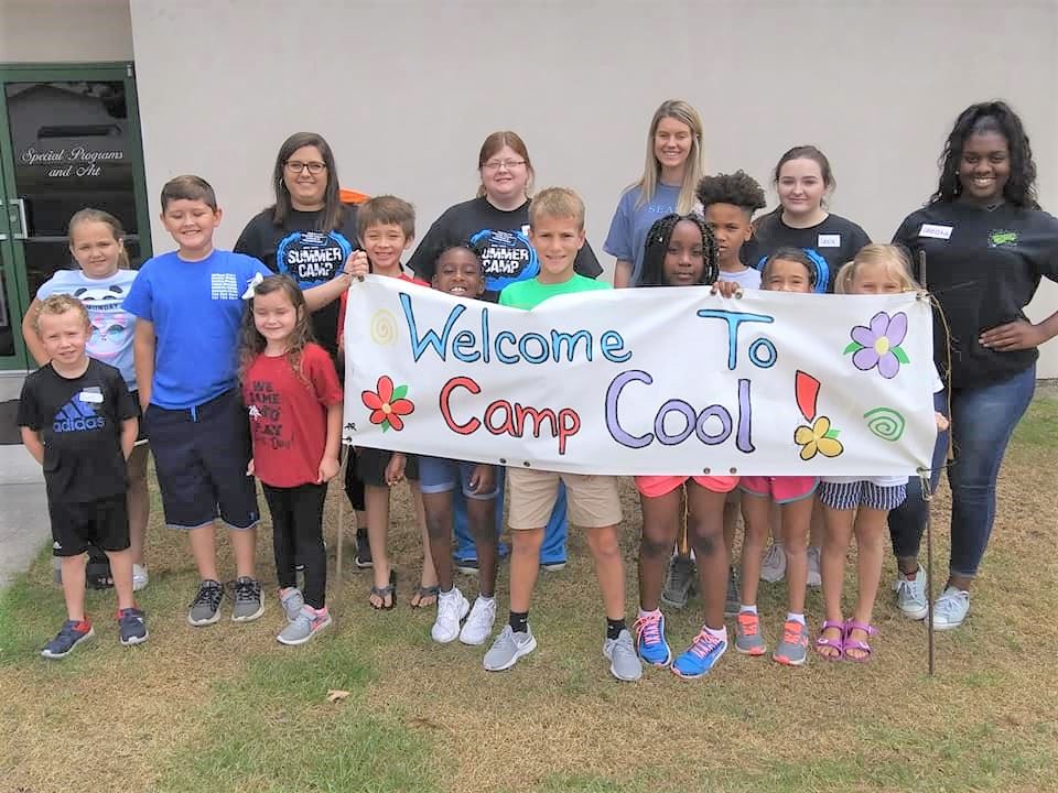 Photo of Children with camp cool sign