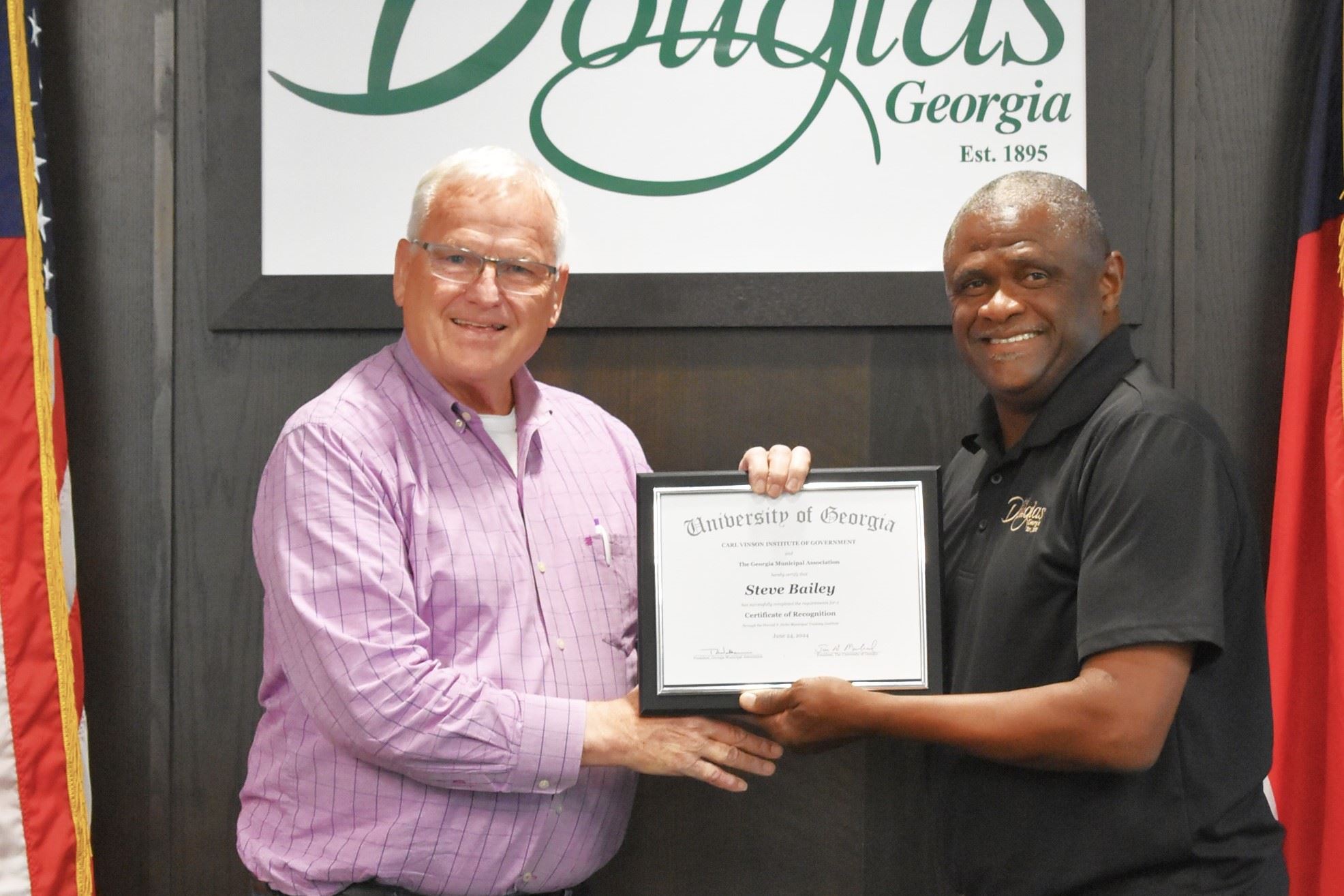 Image of Steve Bailey with his Certificate of Recognition and Mayor Tony Paulk